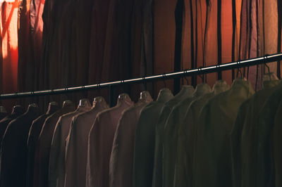 Close-up of clothes hanging at store