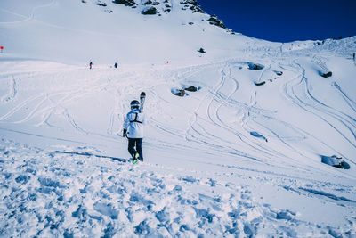 Person skiing on snow covered mountain