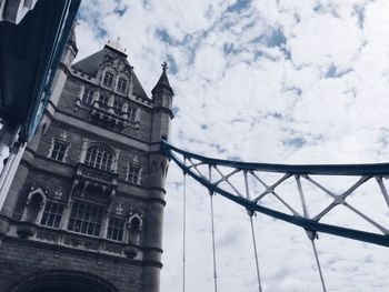 Low angle view of building against cloudy sky