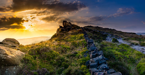 Scenic view of landscape against sky during sunset