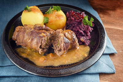 Close-up of fresh food serving in plate on table