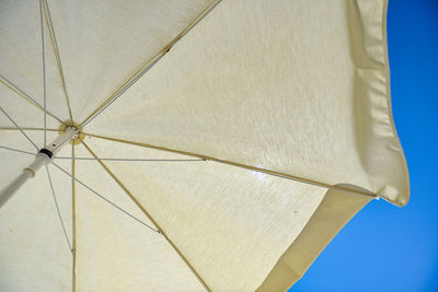 Low angle view of umbrella against sky