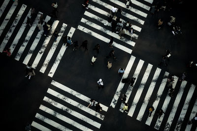 High angle view of people crossing road