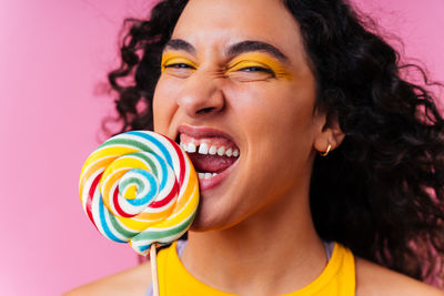 Close-up of young woman with balloons