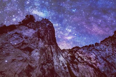 Low angle view of rock formation against sky