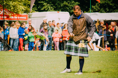 Full length of woman standing on grass