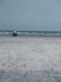 Scenic view of beach against clear sky