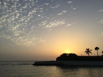 Scenic view of sea against sky at sunset