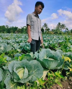 Young man standing in field