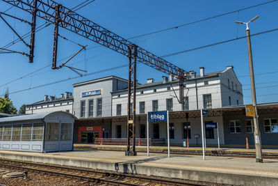 Railroad station against clear sky