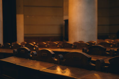 Close-up of benches in temple