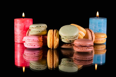 Close-up of birthday cake against black background