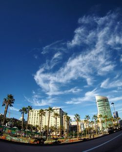 View of modern buildings against blue sky