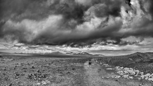 Scenic view of landscape against cloudy sky