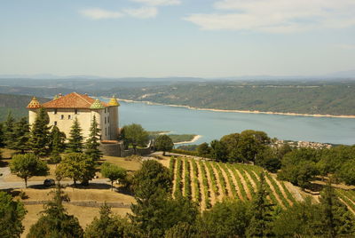 Scenic view of building and mountains against sky