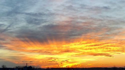 Low angle view of dramatic sky during sunset