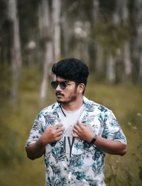 Portrait of young man standing outdoors