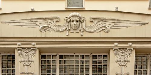 Low angle view of statue on building