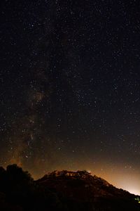 Low angle view of star field against sky at night