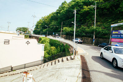 Cars on road against sky