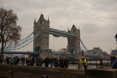 View of suspension bridge against cloudy sky