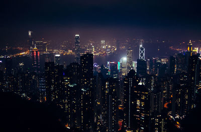 Aerial view of city lit up at night