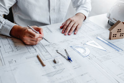 High angle view of man working on table