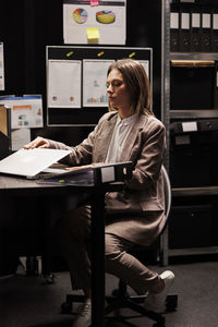 Young woman using laptop at office