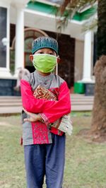 Full length portrait of boy standing outdoors