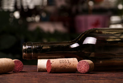 Close-up of wine bottles on table