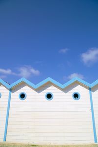 Low angle view of building against blue sky