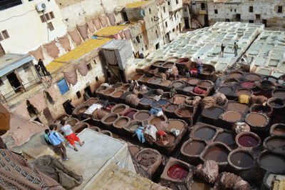 High angle view of people working at traditional dyeing pits