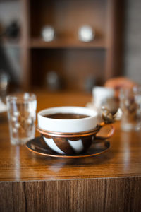 Close-up of tea cup on table