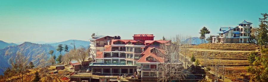 Houses against clear blue sky