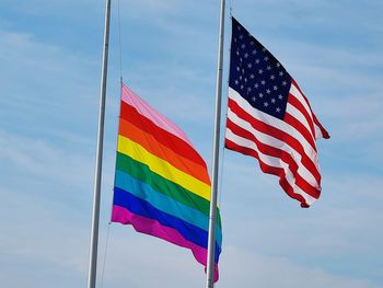 Low angle view of flag against sky