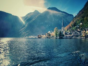 Scenic view of lake and mountains against sky