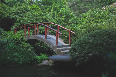 Footbridge against trees