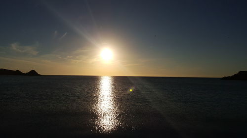 Scenic view of sea against sky at sunset