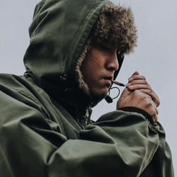 Portrait of young man smoking