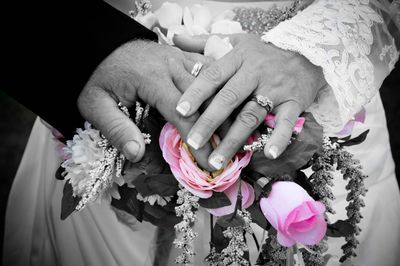 Close-up of woman holding bouquet of flowers