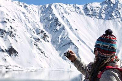 Portrait of person on snowcapped mountains during winter