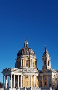 Low angle view of building against blue sky