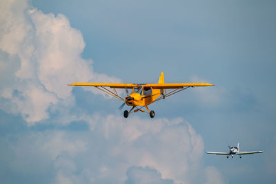 Low angle view of airplane flying in sky