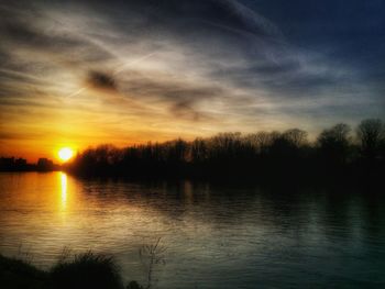 Scenic view of lake at sunset