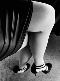 Low section of woman in high heels