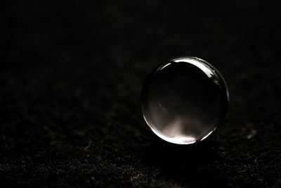 Close-up of crystal ball on table