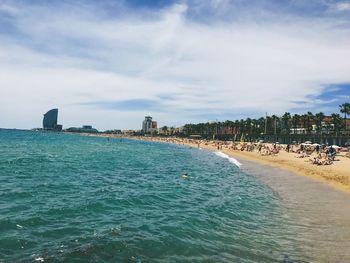 Panoramic view of sea and buildings against sky