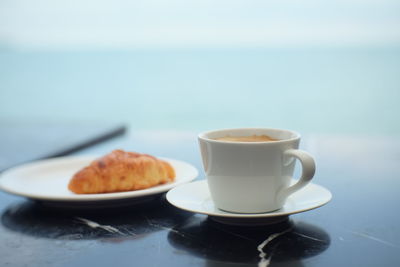 Cup and coffee on table