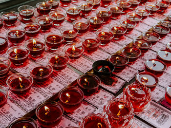 High angle view of red wine glass on table