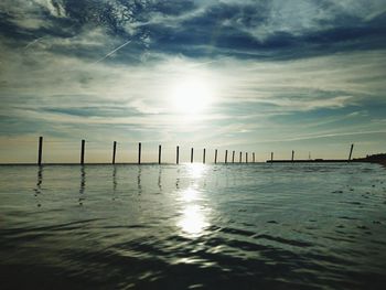 Scenic view of sea against sky at sunset